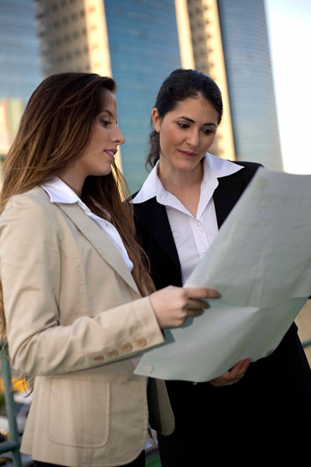 Business Women Reviewing Paperwork