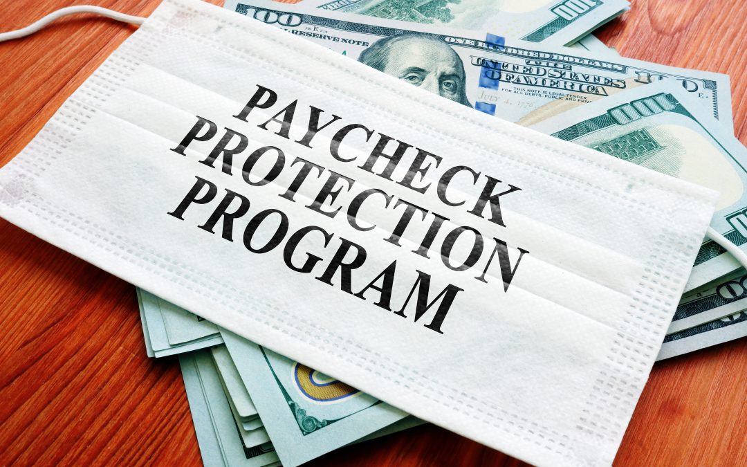 Paycheck Protection Program on a mask over hundred dollar bills